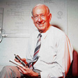 Arthur Bishop at the drawing board with his designs. Courtesy Bishop Technology Group Limited.